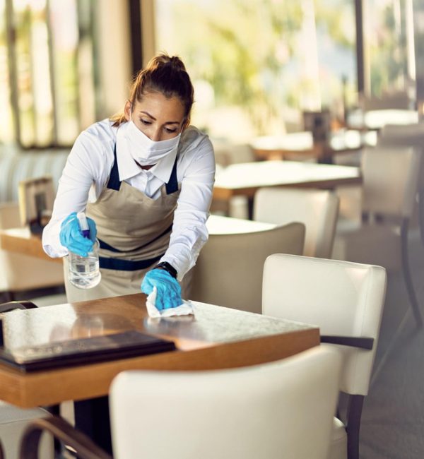 waitress-with-face-mask-disinfec